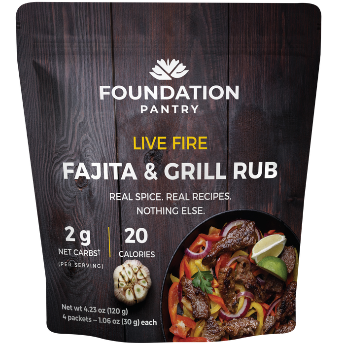 Foundation Pantry Live Fire Fajita and Grill Rub, stand-up pouch with four seasoning packets, front view featuring a meat dish with vegetables and lime.
