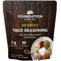 Foundation Pantry Metabolic Taco Seasoning, stand-up pouch with four seasoning packets, front view featuring assorted spices.